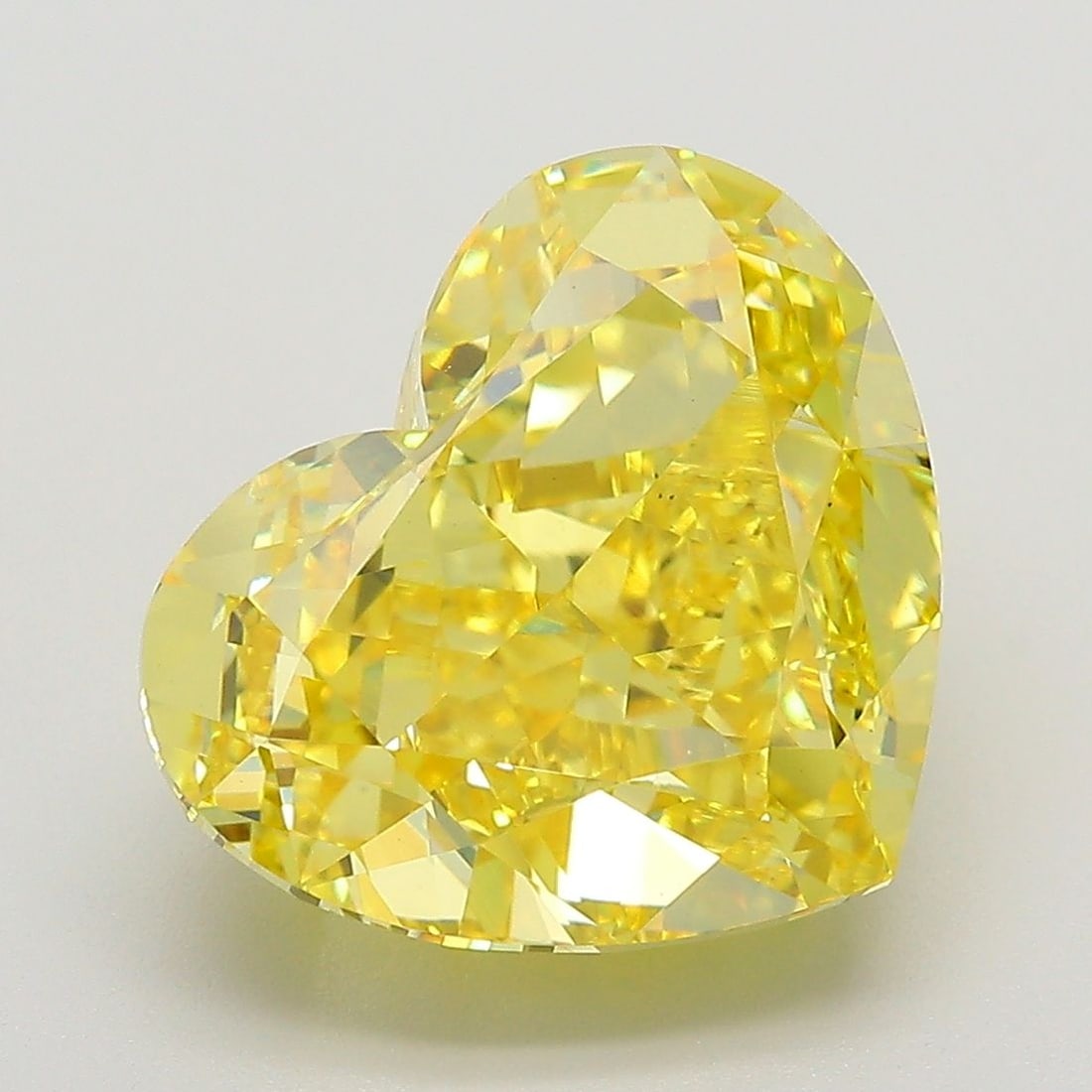 Loose Diamond - HEART 7.16ct Fancy Vivid Yellow VS2: Loose Diamond - HEART 7.16ct Fancy Vivid Yellow VS2 Source: This is a real non-mined Diamond that has been grown in a lab Shape: HEART Carats: 7.16 Color: Fancy Vivid Yellow Certification: IGI The Dia