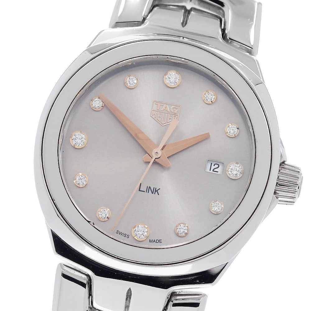 TAG Heuer Link WBC131E women's quartz stainless steel watch: TAG Heuer Link WBC131E women's quartz stainless steel watch TAG Heuer Link women's wristwatch with a quartz movement, gray-brown dial, date display, and stainless steel case and bracelet. This watch i