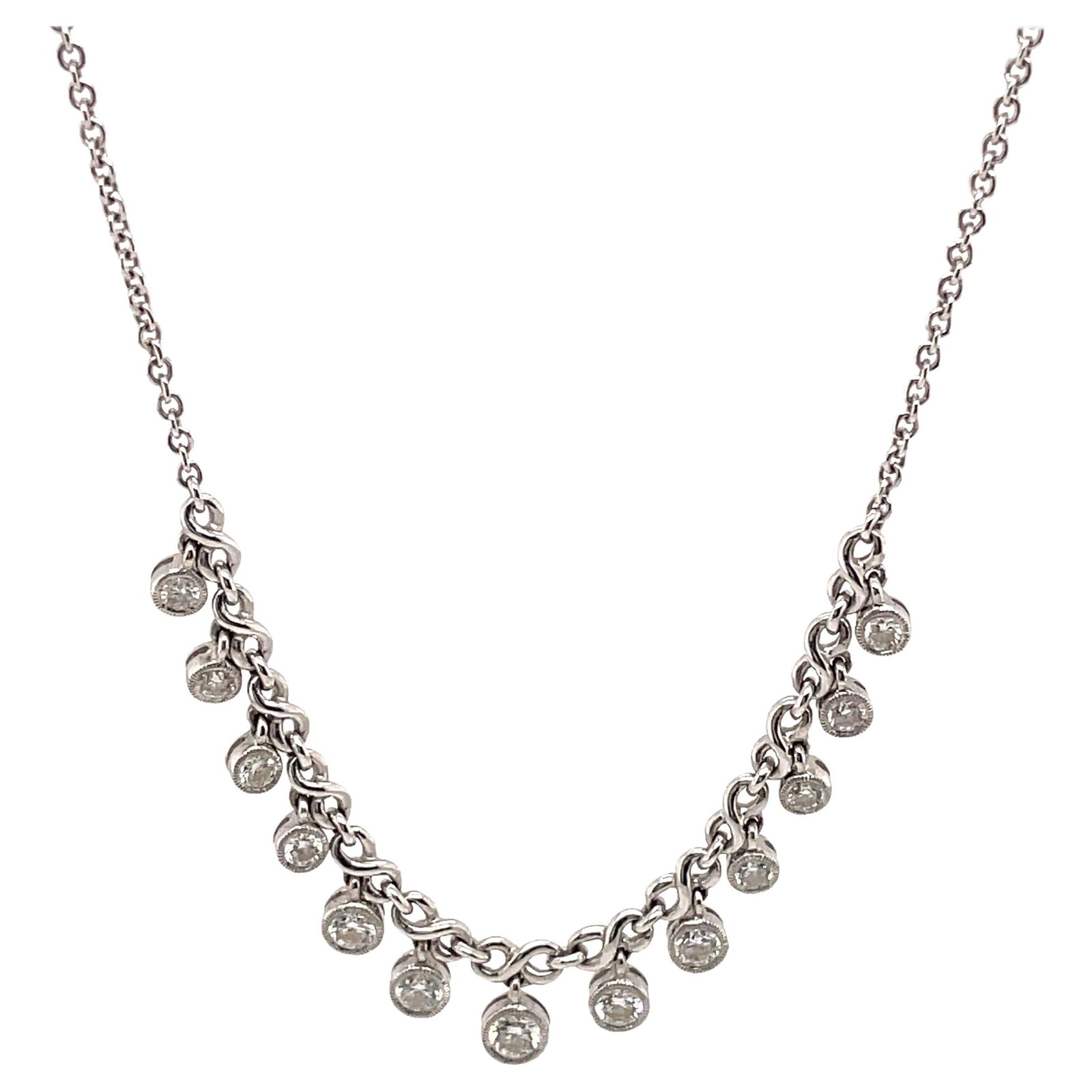 18k White Gold Diamond Dangle Necklace 0.82ct 16 in: 18k White Gold Diamond Dangle Necklace 0.82ct 16 in Contemporary dangling bezel-set diamond necklace featuring 13 round brilliant diamonds totaling 0.82 ct in 18k white gold. Approximate diamond