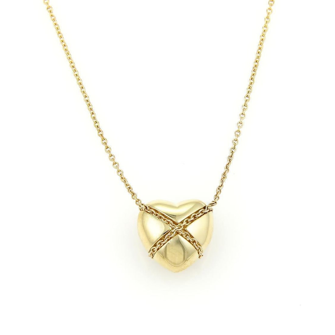 Tiffany & Co. 18k Yellow Gold Heart Pendant Necklace: Tiffany & Co. 18k Yellow Gold Heart Pendant Necklace Discover the elegance of this authentic Tiffany & Co. 18k Yellow Gold Crossover Heart Pendant Necklace. Crafted from luxurious 18k yellow gold with
