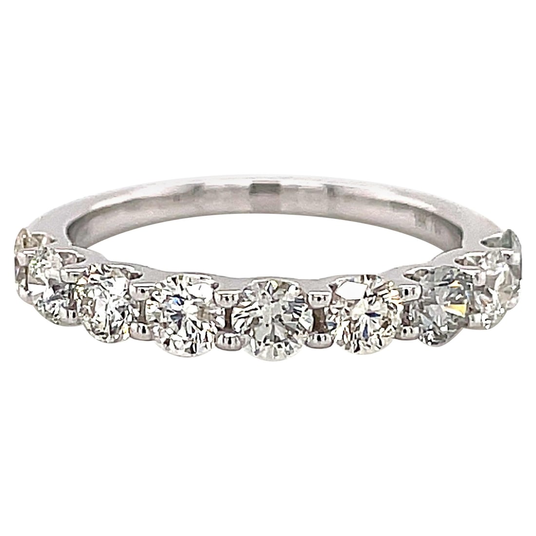 18k White Gold Diamond Half Eternity Ring 1.24ct: 18k White Gold Diamond Half Eternity Ring 1.24ct Timeless diamond eternity half band featuring 9 round brilliant diamonds totaling 1.24 ct, set in 18k white gold. Contemporary in style, this ring is u