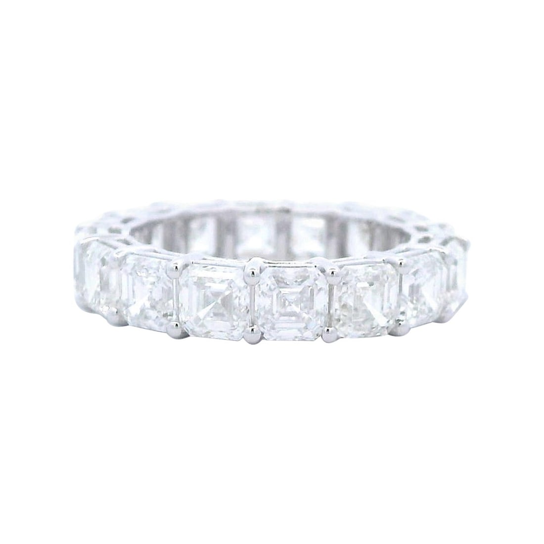 18k White Gold Eternity Band 6.36ct Asscher Diamond 5.5: 18k White Gold Eternity Band 6.36ct Asscher Diamond 5.5 Contemporary eternity band set with 16 Asscher cut white diamonds totaling 6.36 ct. The diamonds are graded D/E color and VS1 clarity and are mo