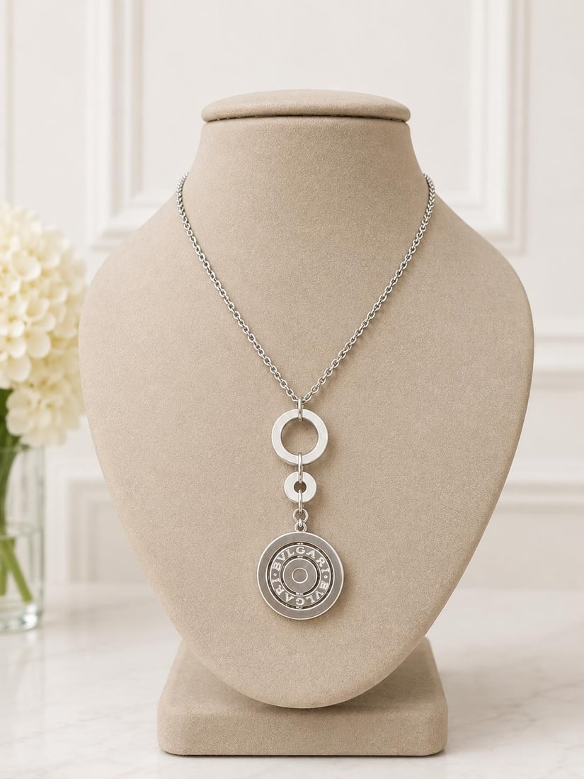 Bvlgari Astrale Cerchi 18k White Gold Pendant Necklace Adjustable Chain: Bvlgari Astrale Cerchi 18k White Gold Pendant Necklace Adjustable Chain Bulgari Astrale Cerchi necklace crafted in solid 18k white gold, featuring a circular pendant on an adjustable cable link chain.