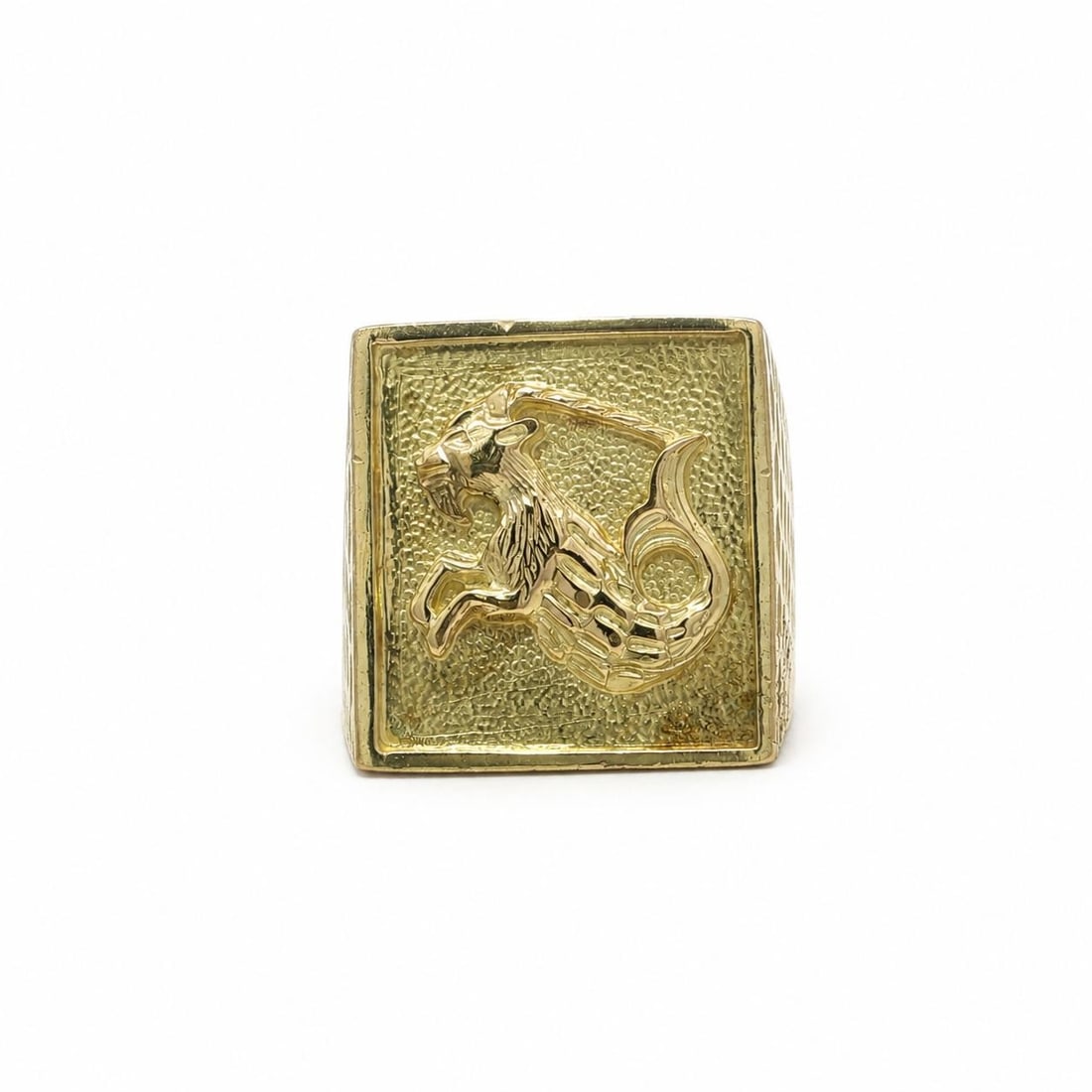 Capricorn Zodiac Signet Ring in 13-14k Yellow Gold: Capricorn Zodiac Signet Ring in 13-14k Yellow Gold Vintage unisex signet ring featuring a Capricorn zodiac design with a textured squared top. Crafted in solid 13-14k yellow gold, this pre-owned ring 