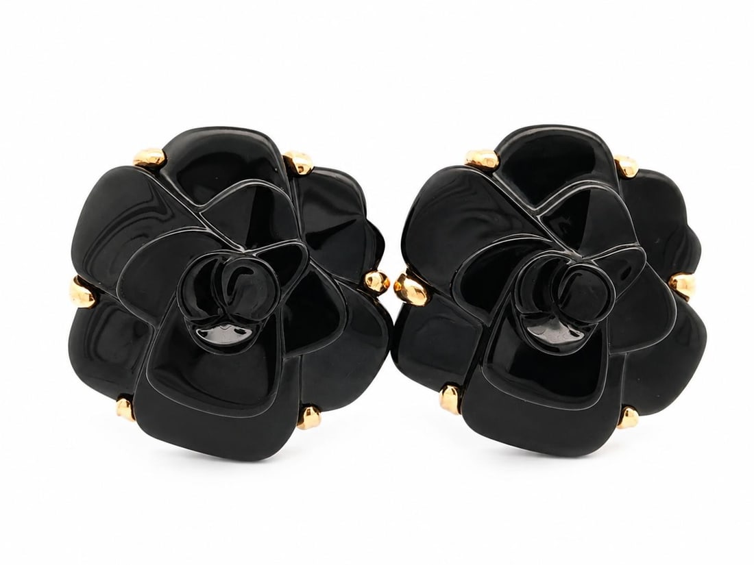 Chanel Camelia Clip On Earrings 18k Yellow Gold Carved Black Flower: Chanel Camelia Clip On Earrings 18k Yellow Gold Carved Black Flower Vintage Chanel clip-on earrings featuring a large camelia-inspired carved flower design with polished black stones set in 18k solid 