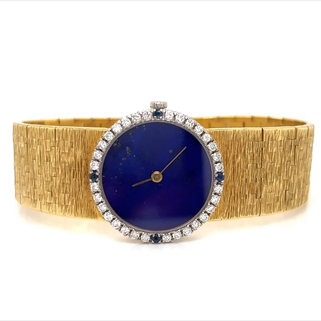 Piaget 18K Gold Lapis Lazuli Diamond Sapphire Watch: Piaget 18K Gold Lapis Lazuli Diamond Sapphire Watch This exquisite Piaget watch features an 18K yellow gold case and a stunning Lapis Lazuli dial. The watch is adorned with an original bezel set with 