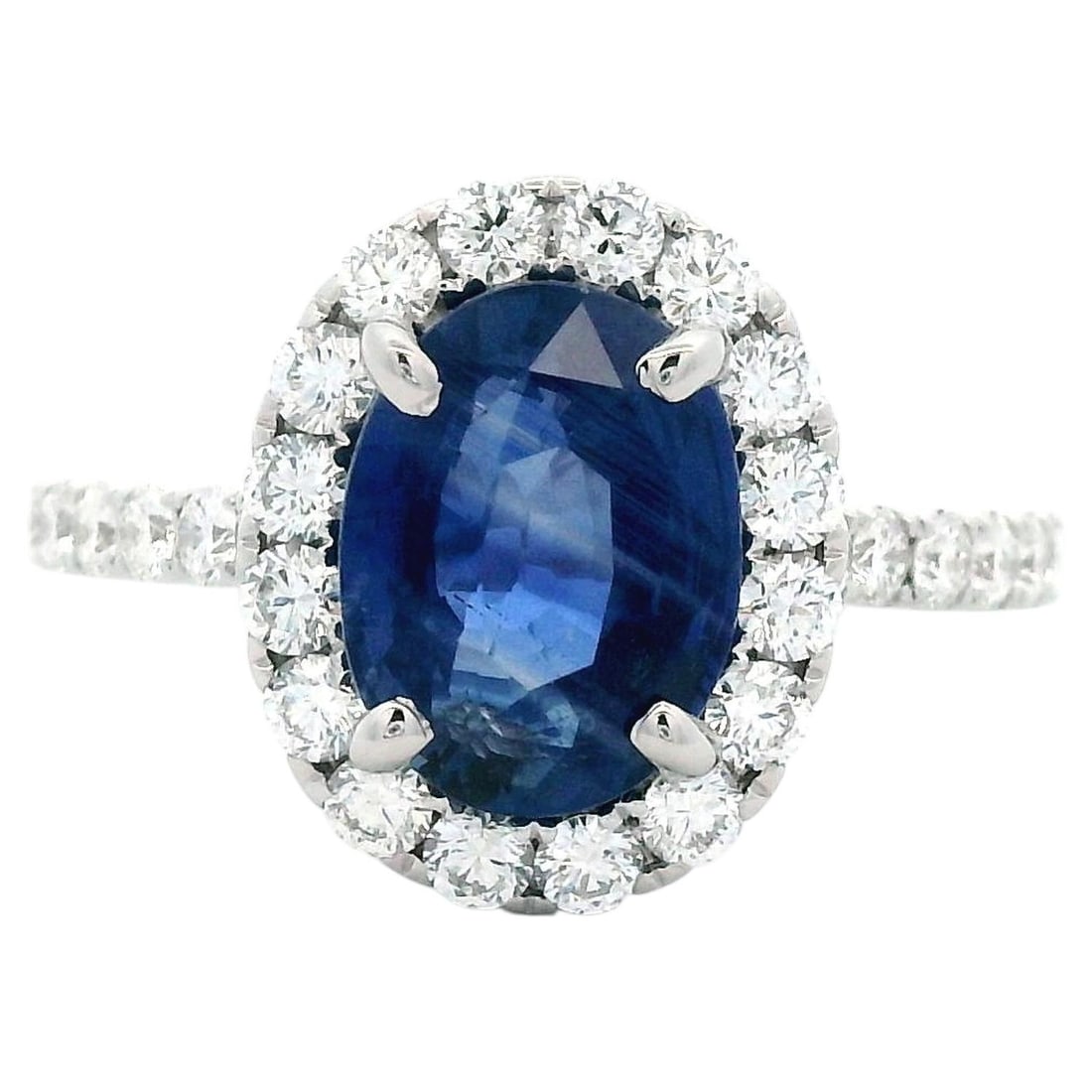 18k White Gold Ring with 3.03ct GIA Ceylon Sapphire: 18k White Gold Ring with 3.03ct GIA Ceylon Sapphire GIA-certified ring featuring a 3.03 ct no-heat oval Ceylon sapphire surrounded by a diamond halo. This contemporary 18k white gold ring has a total 