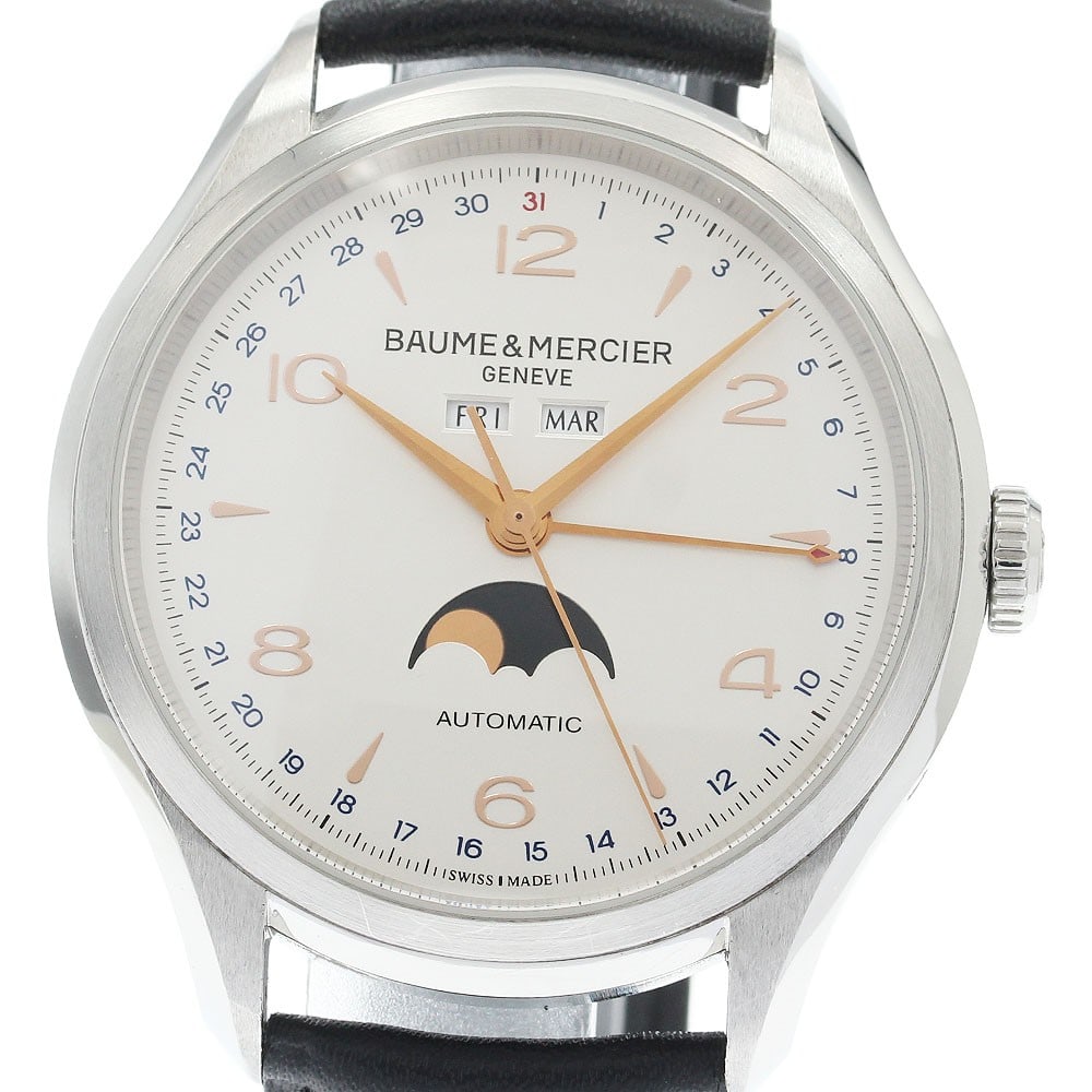 Baume and Mercier Clifton Moonphase Triple Calendar Auto Mens Watch 65718: Baume and Mercier Clifton Moonphase Triple Calendar Auto Mens Watch 65718 Baume & Mercier Clifton Moonphase Triple Calendar automatic men's wristwatch. This Swiss-made watch features a silver dial and