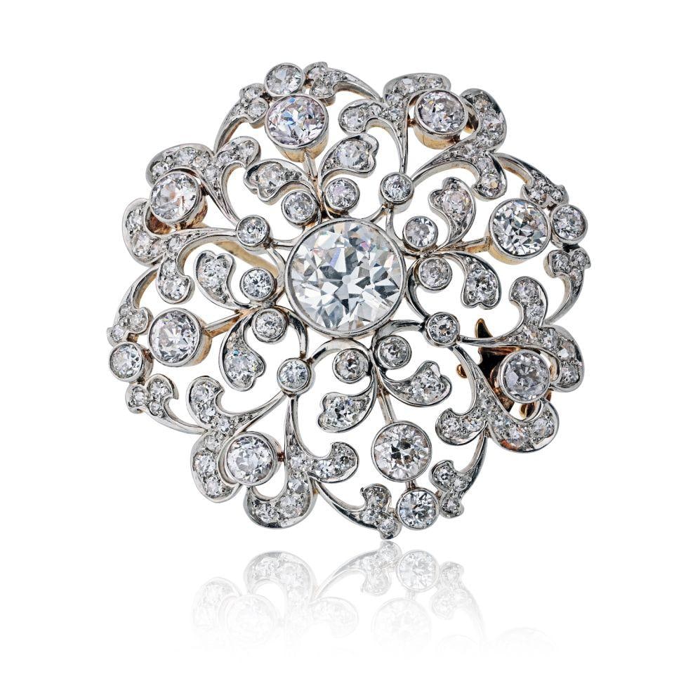 Marcus & Co. Diamond Brooch in Platinum and 18K Yellow Gold: Marcus & Co. Diamond Brooch in Platinum and 18K Yellow Gold Pre-owned Marcus & Co. brooch crafted in platinum and 18K yellow gold, accented with approximately 4 cts of diamonds. Specifications Type: B