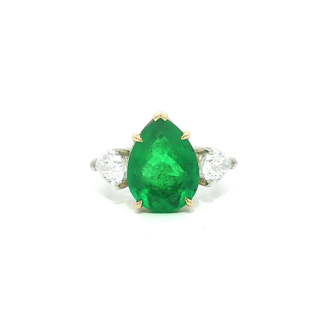 Custom Platinum Ring with 18k Gold 7.03ctw Colombian Emerald and GIA Diamonds: Custom Platinum Ring with 18k Gold 7.03ctw Colombian Emerald and GIA Diamonds Custom ring featuring a natural pear-cut Colombian emerald accented by two pear-cut natural diamonds. The emerald is AGL c
