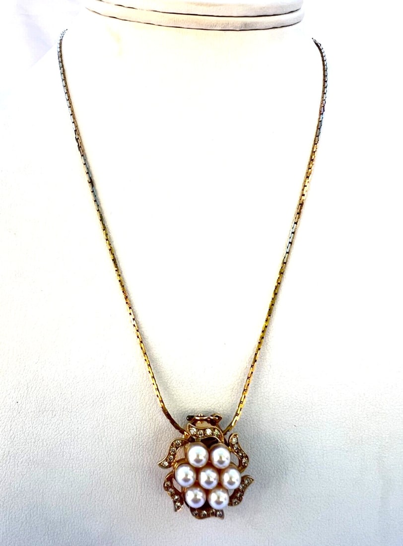 Joshua 14K Yellow Gold Pendant Necklace with Diamond and Pearl: Joshua 14K Yellow Gold Pendant Necklace with Diamond and Pearl Pre-owned 14K yellow gold pendant necklace featuring diamond and pearl accents. This signed and hallmarked piece is noted for its detaile