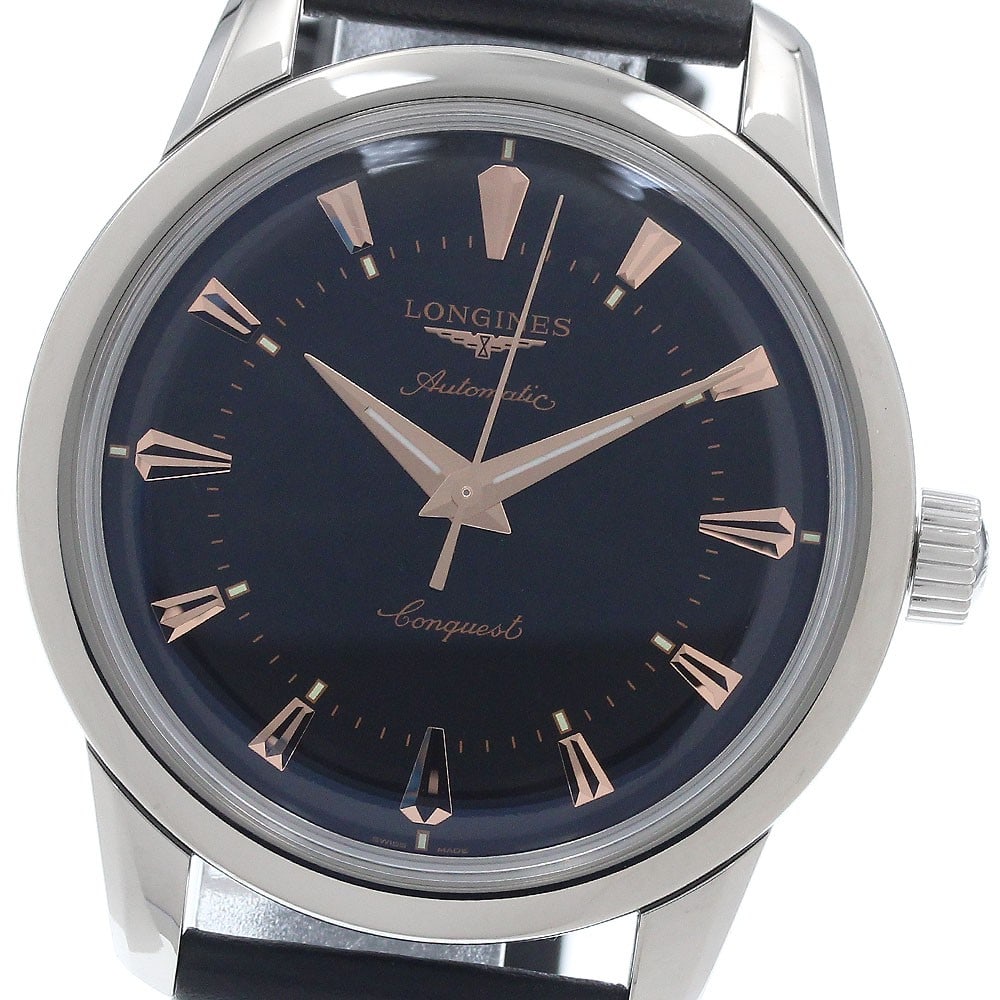 Longines Conquest Heritage automatic mens wristwatch ref L1.649.4: Longines Conquest Heritage automatic mens wristwatch ref L1.649.4 Longines Conquest Heritage automatic men's wristwatch with a black dial, stainless steel case, and leather strap. Includes outer and i