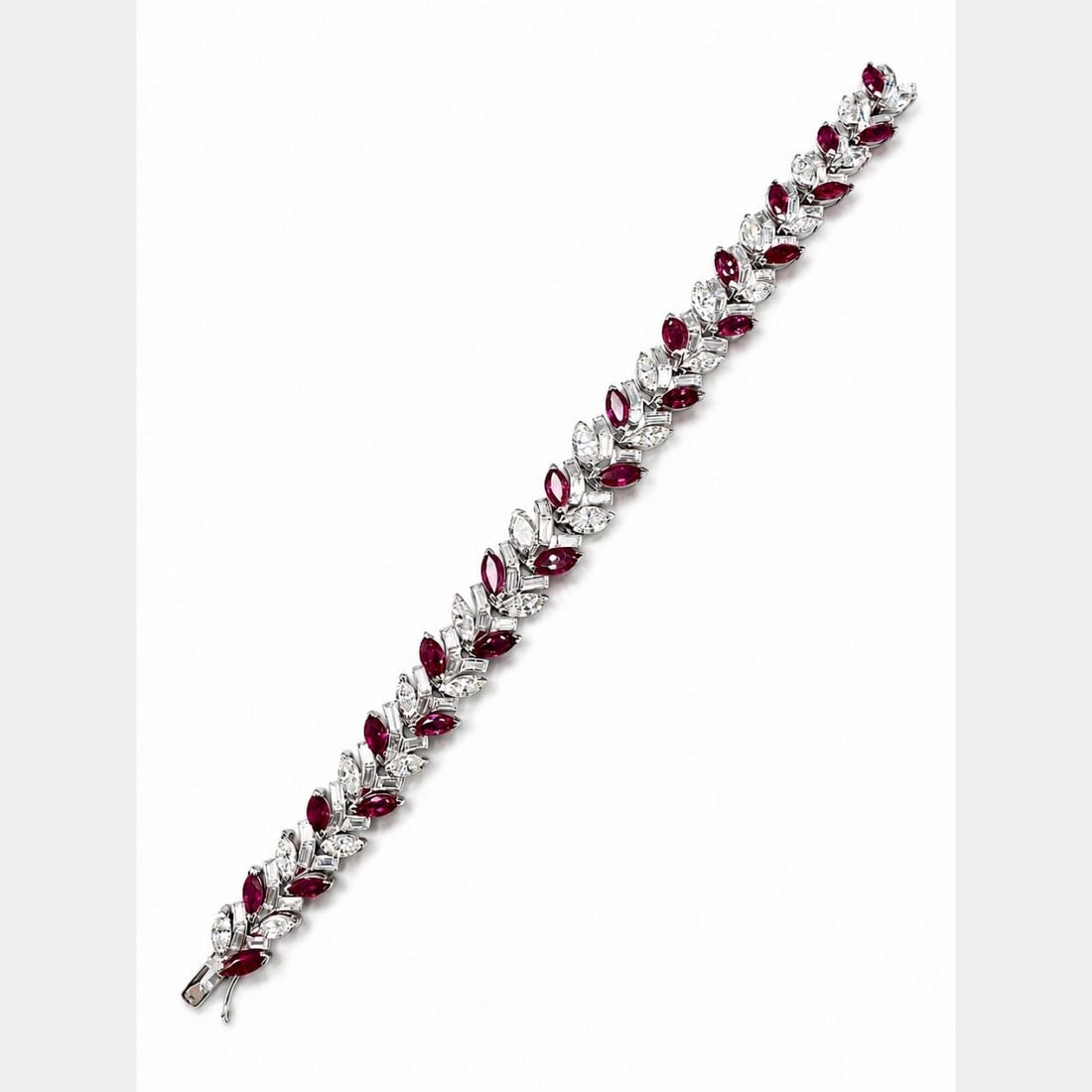 Platinum bracelet with Burma no-heat rubies and diamonds 1960s: Platinum bracelet with Burma no-heat rubies and diamonds 1960s Vintage 1960s bracelet crafted in platinum and set with no-heat Burma rubies and diamonds. This pre-owned piece features a substantial, f