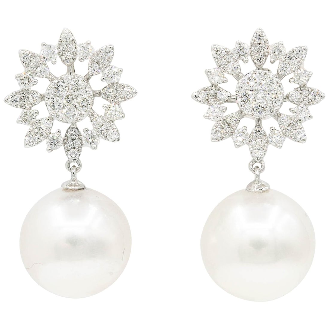 18K White Gold South Sea Pearl Diamond Dangle Earrings: 18K White Gold South Sea Pearl Diamond Dangle Earrings Pair of contemporary dangle earrings in 18k white gold, designed with a marquise-shaped star or cluster motif set with round-cut diamonds and fin