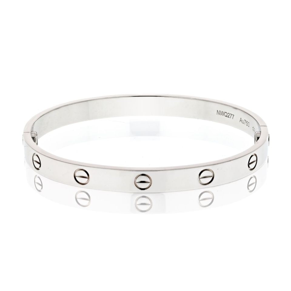 Cartier Love bracelet in 18K white gold size 18: Cartier Love bracelet in 18K white gold size 18 Pre-owned Cartier Love bracelet in 18K white gold. This iconic design features the signature screw motif and comes with a screwdriver for secure fasteni