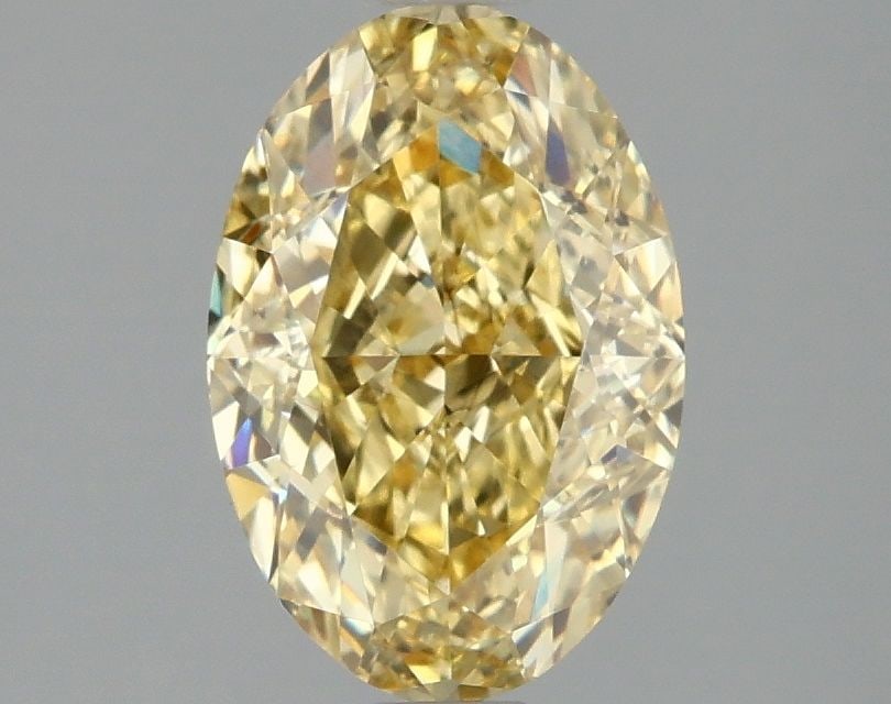 Loose Diamond - OVAL 2.1ct Fancy Vivid Yellow VS2: Loose Diamond - OVAL 2.1ct Fancy Vivid Yellow VS2 Source: This is a real non-mined Diamond that has been grown in a lab Shape: OVAL Carats: 2.1 Color: Fancy Vivid Yellow Certification: IGI Video: