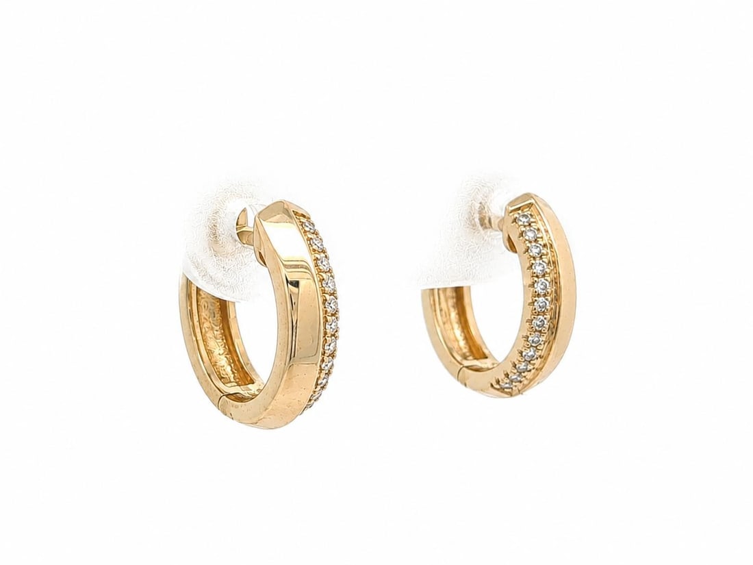 14k Yellow Gold Huggie Hoop Earrings with Pave Diamonds Knife Edge: 14k Yellow Gold Huggie Hoop Earrings with Pave Diamonds Knife Edge Petite huggie hoop earrings in solid 14k yellow gold with a knife edge profile and single pave-set natural diamonds. This pre-owned p