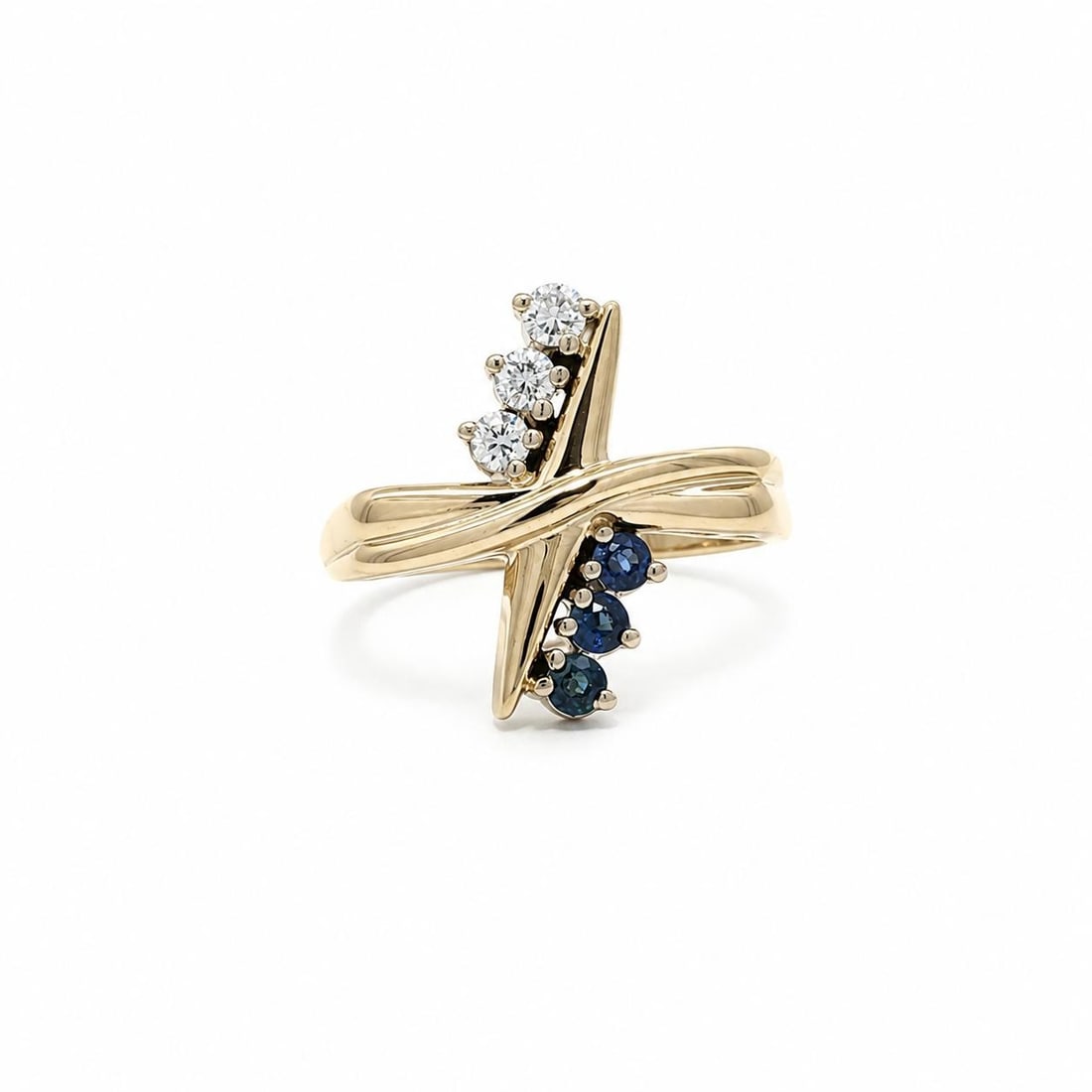 14k Yellow Gold Band Ring with Blue Sapphires and 3 Diamonds: 14k Yellow Gold Band Ring with Blue Sapphires and 3 Diamonds Pre-owned women's band ring crafted in solid 14k yellow gold with a criss cross grooved design. It features 3 natural blue sapphires and 3 