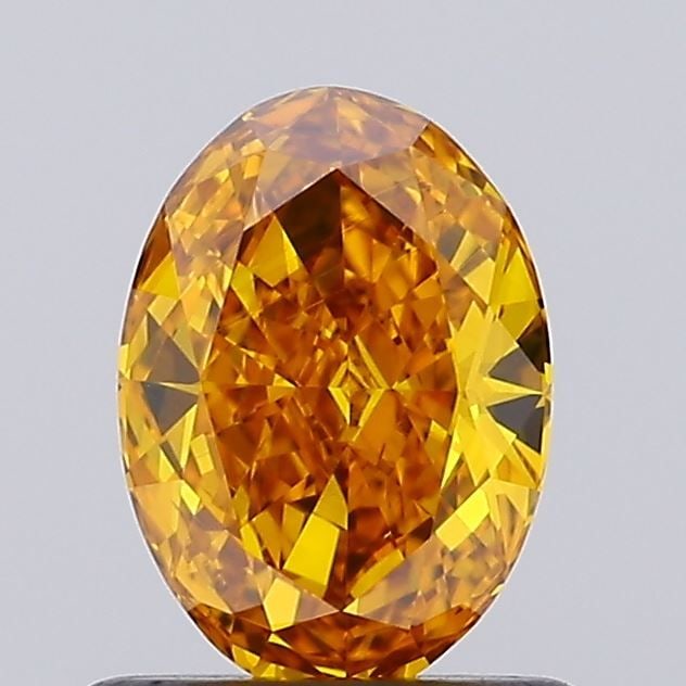 Loose Diamond - OVAL 0.72ct Fancy Vivid Orangey Yellow VS1: Loose Diamond - OVAL 0.72ct Fancy Vivid Orangey Yellow VS1 Source: This is a real non-mined Diamond that has been grown in a lab Shape: OVAL Carats: 0.72 Color: Fancy Vivid Orangey Yellow Certificatio