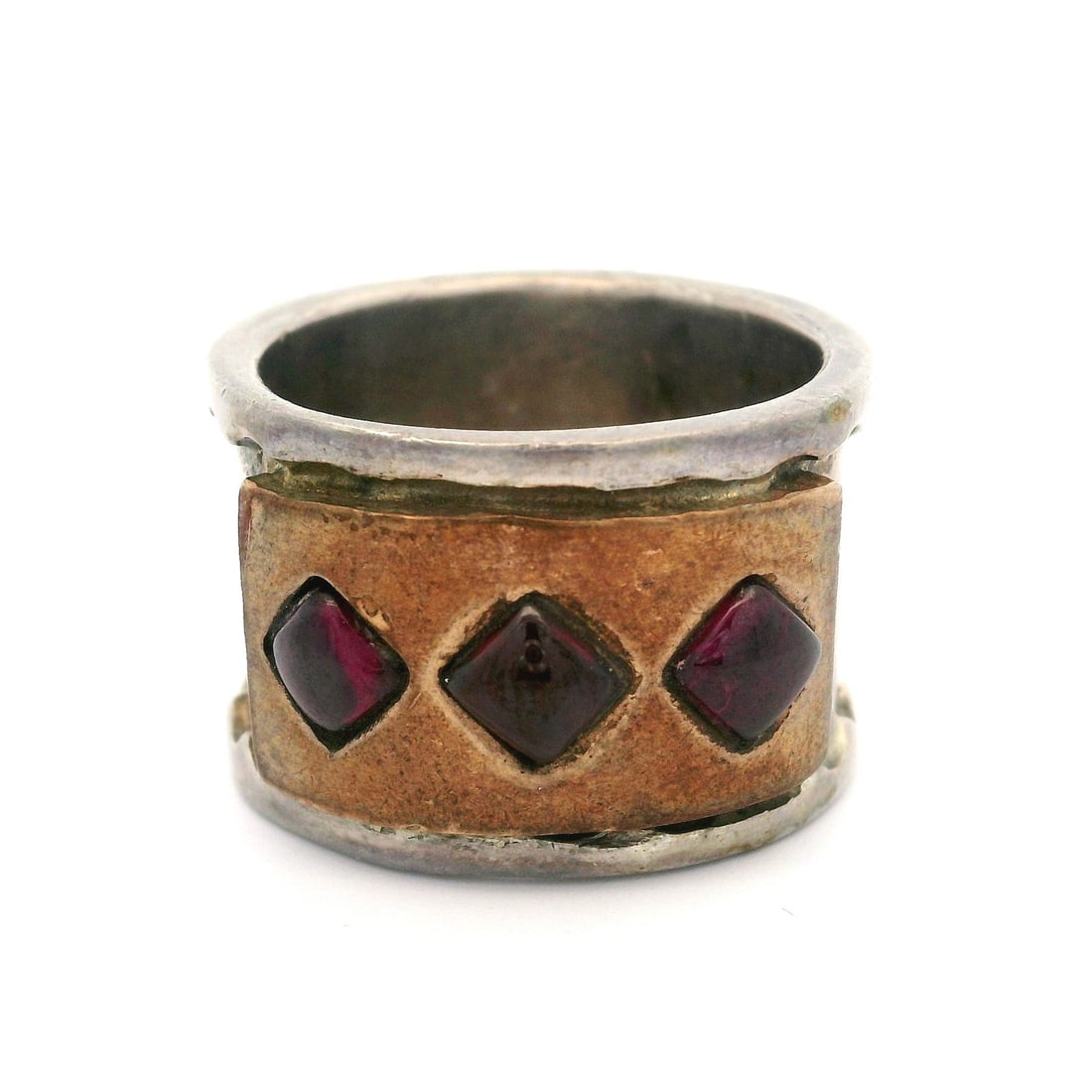 Vintage Sterling Silver Wide Band Ring with Rhodolite Garnet: Vintage Sterling Silver Wide Band Ring with Rhodolite Garnet This exquisite vintage wide band ring features a stunning design crafted from genuine sterling silver, showcasing three square cabochon Rho