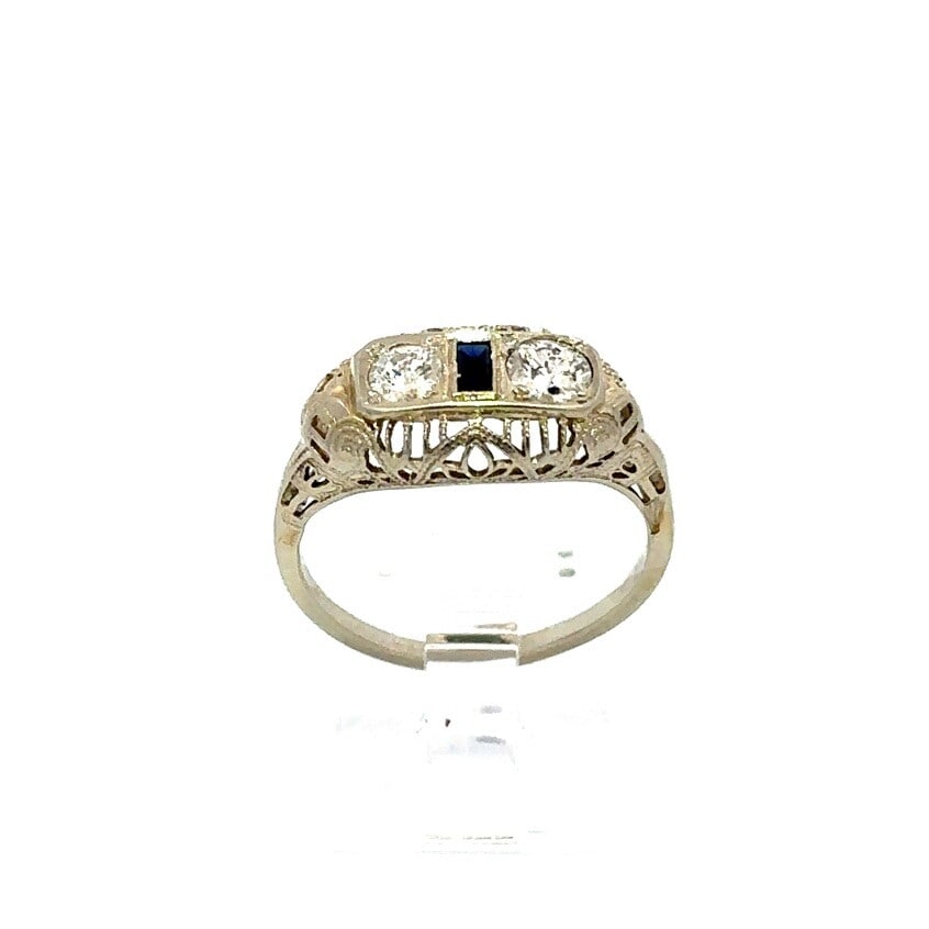 Antique Art Deco 18k White Gold Diamond Sapphire Filigree Ring 0.42ctw: Antique Art Deco 18k White Gold Diamond Sapphire Filigree Ring 0.42ctw This exquisite Antique Art Deco ring features a stunning combination of two Old European cut diamonds and a baguette French cut s