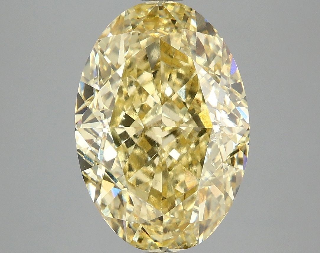 Loose Diamond - OVAL 5.1ct Fancy Vivid Yellow VS1: Loose Diamond - OVAL 5.1ct Fancy Vivid Yellow VS1 Source: This is a real non-mined Diamond that has been grown in a lab Shape: OVAL Carats: 5.1 Color: Fancy Vivid Yellow Certification: IGI Video: