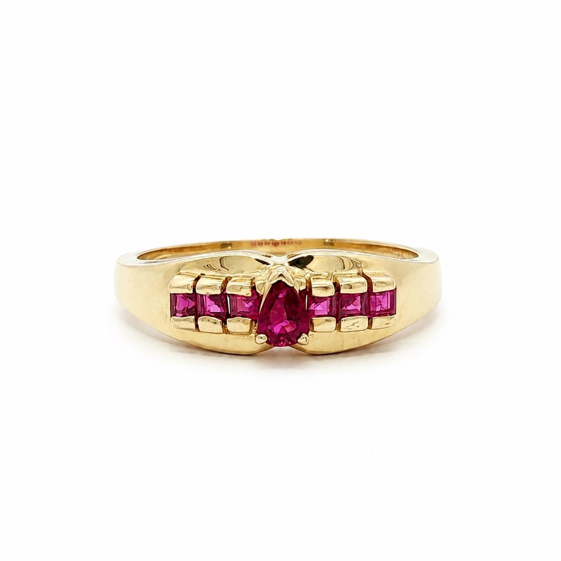 14k Yellow Gold Ruby Cocktail Ring Pear and Square Step Cut: 14k Yellow Gold Ruby Cocktail Ring Pear and Square Step Cut Pre-owned cocktail ring crafted in solid 14k yellow gold and set with natural genuine rubies. The design features one pear-cut ruby accented
