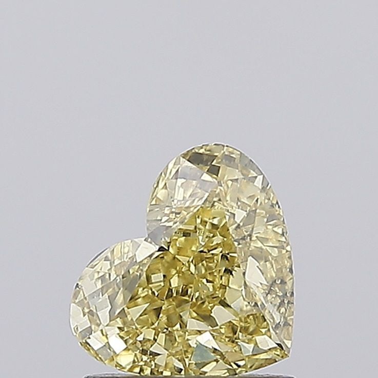 Loose Diamond - HEART 1.09ct Fancy Vivid Yellow VS1: Loose Diamond - HEART 1.09ct Fancy Vivid Yellow VS1 Source: This is a real non-mined Diamond that has been grown in a lab Shape: HEART Carats: 1.09 Color: Fancy Vivid Yellow Certification: IGI Video: