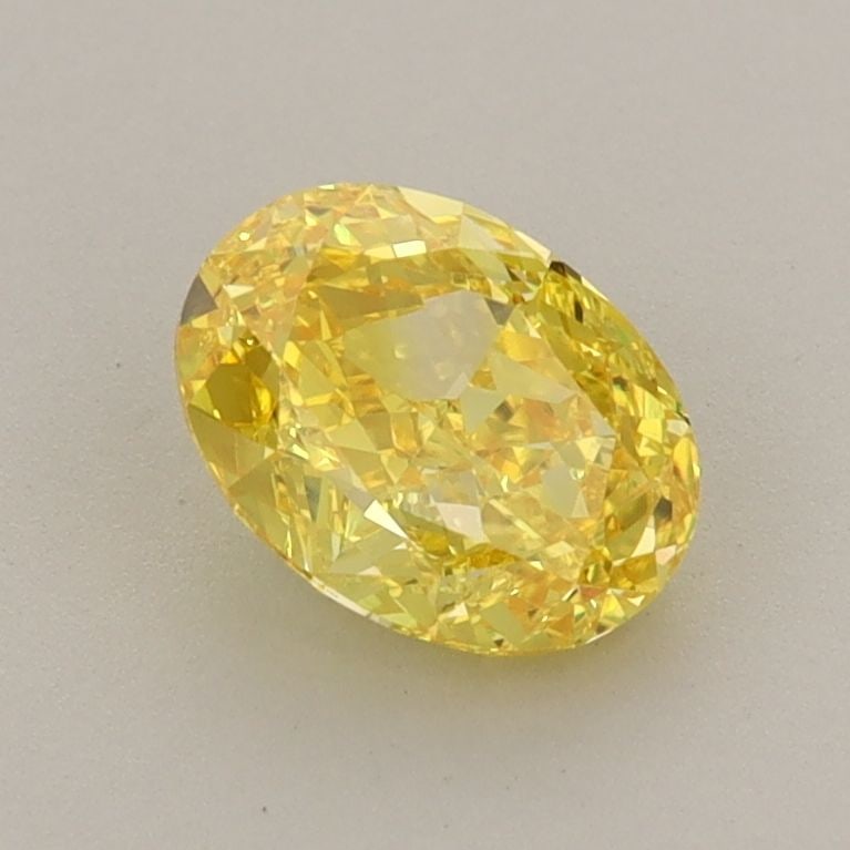 Loose Diamond - OVAL 1.04ct Fancy Vivid Yellow VVS2: Loose Diamond - OVAL 1.04ct Fancy Vivid Yellow VVS2 Source: This is a real non-mined Diamond that has been grown in a lab Shape: OVAL Carats: 1.04 Color: Fancy Vivid Yellow Certification: IGI The Diam