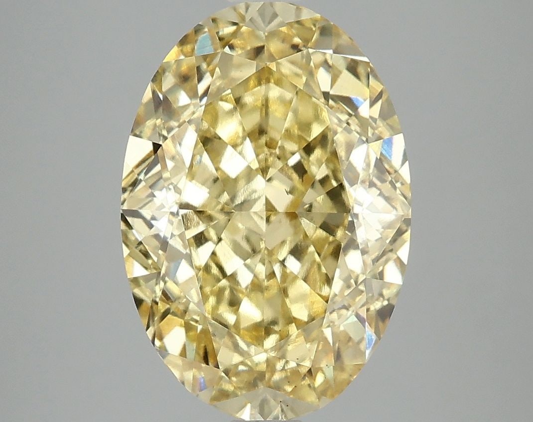 Loose Diamond - OVAL 5.04ct Fancy Vivid Yellow VS2: Loose Diamond - OVAL 5.04ct Fancy Vivid Yellow VS2 Source: This is a real non-mined Diamond that has been grown in a lab Shape: OVAL Carats: 5.04 Color: Fancy Vivid Yellow Certification: IGI Video: