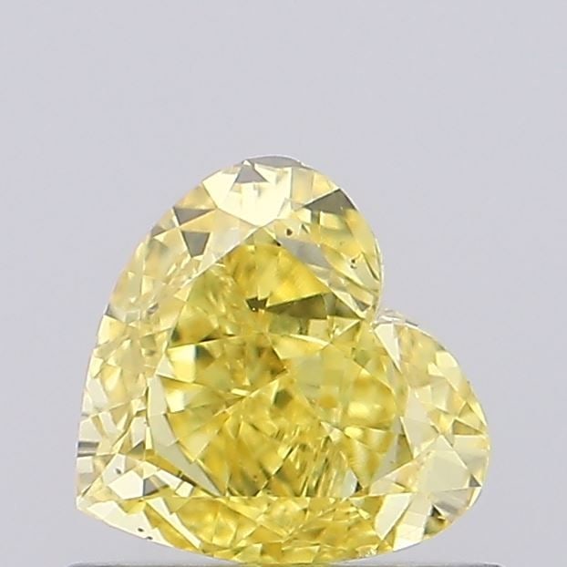 Loose Diamond - HEART 0.66ct Fancy Vivid Yellow VS2: Loose Diamond - HEART 0.66ct Fancy Vivid Yellow VS2 Source: This is a real non-mined Diamond that has been grown in a lab Shape: HEART Carats: 0.66 Color: Fancy Vivid Yellow Certification: NONE Video: