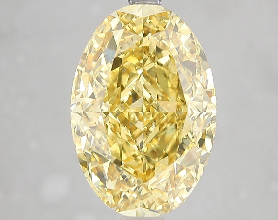 Loose Diamond - OVAL 5.12ct Fancy Vivid Yellow VS2: Loose Diamond - OVAL 5.12ct Fancy Vivid Yellow VS2 Source: This is a real non-mined Diamond that has been grown in a lab Shape: OVAL Carats: 5.12 Color: Fancy Vivid Yellow Certification: IGI Video: