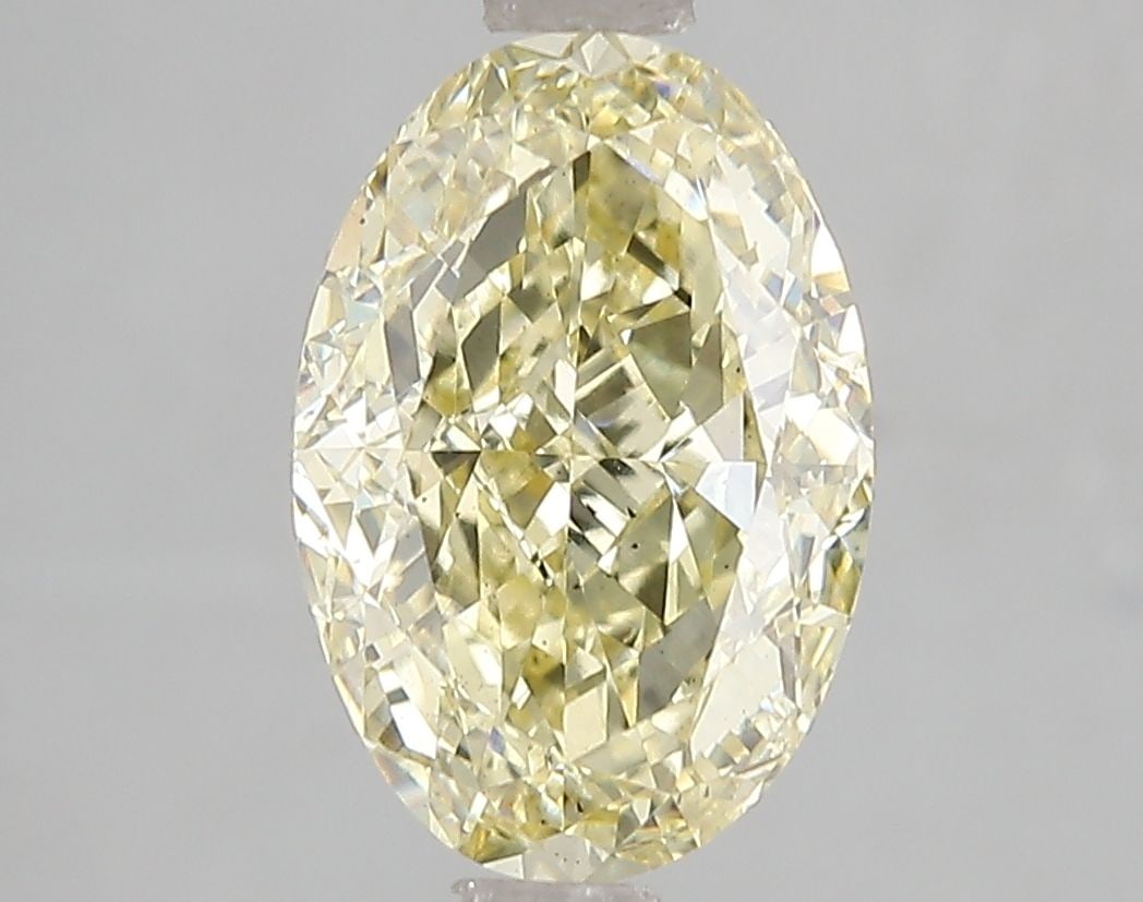 Loose Diamond - OVAL 3.0ct Fancy Yellow VS2: Loose Diamond - OVAL 3.0ct Fancy Yellow VS2 Source: This is a real non-mined Diamond that has been grown in a lab Shape: OVAL Carats: 3.0 Color: Fancy Yellow Certification: IGI Video: