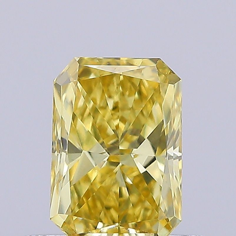 Loose Diamond - RADIANT 0.55ct Fancy Vivid Yellow VS1: Loose Diamond - RADIANT 0.55ct Fancy Vivid Yellow VS1 Source: This is a real non-mined Diamond that has been grown in a lab Shape: RADIANT Carats: 0.55 Color: Fancy Vivid Yellow Certification: IGI Vid