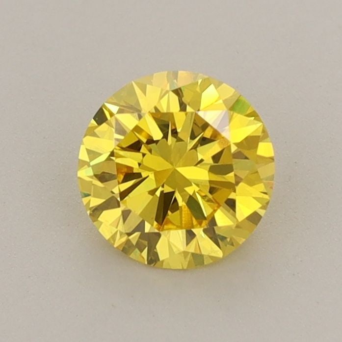 Loose Diamond - ROUND 0.73ct Fancy Vivid Yellow VVS2: Loose Diamond - ROUND 0.73ct Fancy Vivid Yellow VVS2 Source: This is a real non-mined Diamond that has been grown in a lab Shape: ROUND Carats: 0.73 Color: Fancy Vivid Yellow Certification: IGI Video: