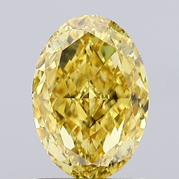 Loose Diamond - OVAL 1.02ct Fancy Vivid Yellow SI1: Loose Diamond - OVAL 1.02ct Fancy Vivid Yellow SI1 Source: This is a real non-mined Diamond that has been grown in a lab Shape: OVAL Carats: 1.02 Color: Fancy Vivid Yellow Certification: IGI Video: