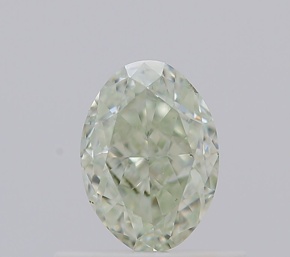 Loose Diamond - OVAL 0.66ct Fancy Light Yellow Green VS2: Loose Diamond - OVAL 0.66ct Fancy Light Yellow Green VS2 Source: Natural Shape: OVAL Carats: 0.66 Color: Fancy Light Yellow Green Certification: GIA The Diamond Depot Guarantee: All items in this auct