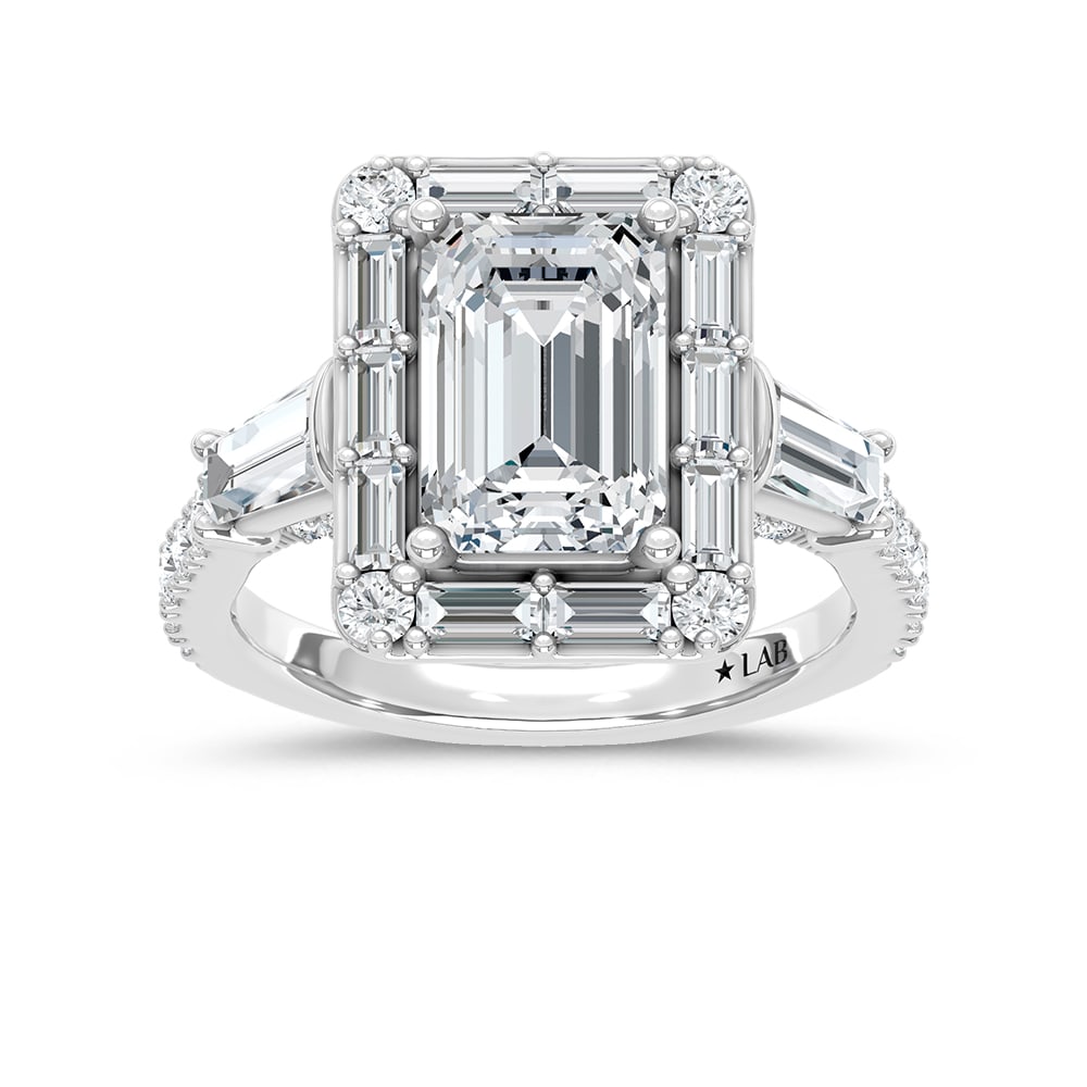 14K White Gold Lab Grown Diamond 4 5/8 Ct.Tw. Emerald Cut Engagement Ring (Center 3ct): 14K White Gold Lab Grown Diamond 4 5/8 Ct.Tw. Emerald Cut Engagement Ring (Center 3ct) 14k White Gold Stone Color: D-f Stone Clarity: Vs Stone Shape: Round / Straight Buggete / Tapper V Shape This ite