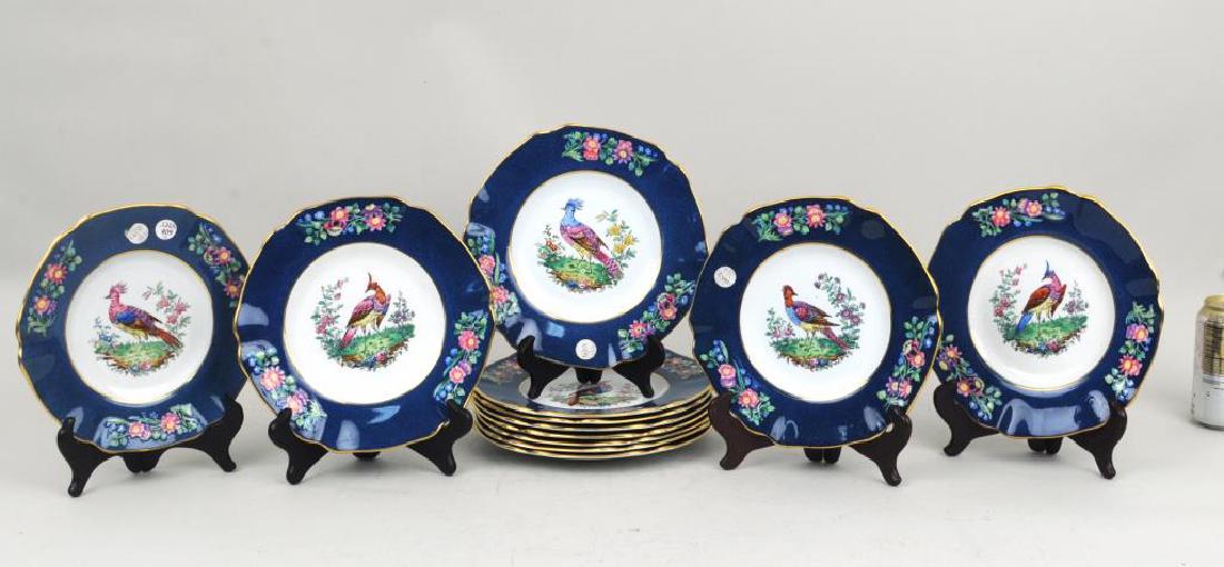 Set Twelve Copeland Spode Bird Decorated Plates: Set of twelve Copeland Spode bird decorated plates with raised floral borders. A few plates with light crazing. 8 3/4" diameter. Provenance: From a New Haven estate.