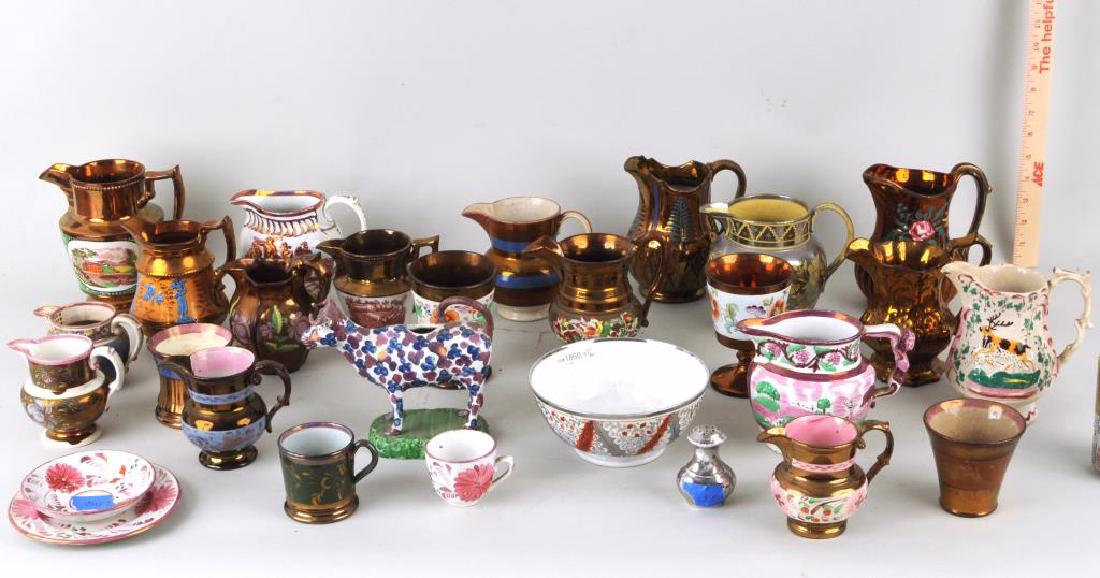 Large Estate Group Porcelain Lustre Items: The group of 28 items including pitchers, plates, a cow creamer and other items. Glaze wear, loss, chips, cracks, losses, repairs. Largest: 6 1/4" by 6 1/2"; smallest 2 1/4" by 3". Provenance: Estate