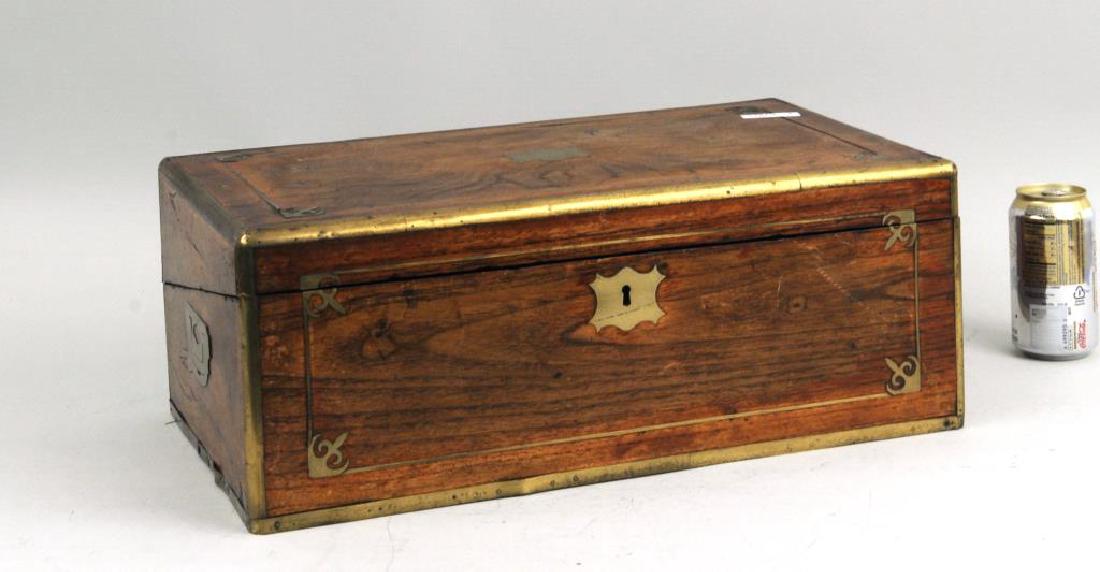 Regency Brass Mounted/Inlaid Mahogany Writing Desk: Regency brass mounted and inlaid mahogany writing desk. Finish wear, loss, age cracks, stains, dings, bends in brass banding. 7 1/4" high, 19 1/2" wide. Provenance: From a New Haven estate.