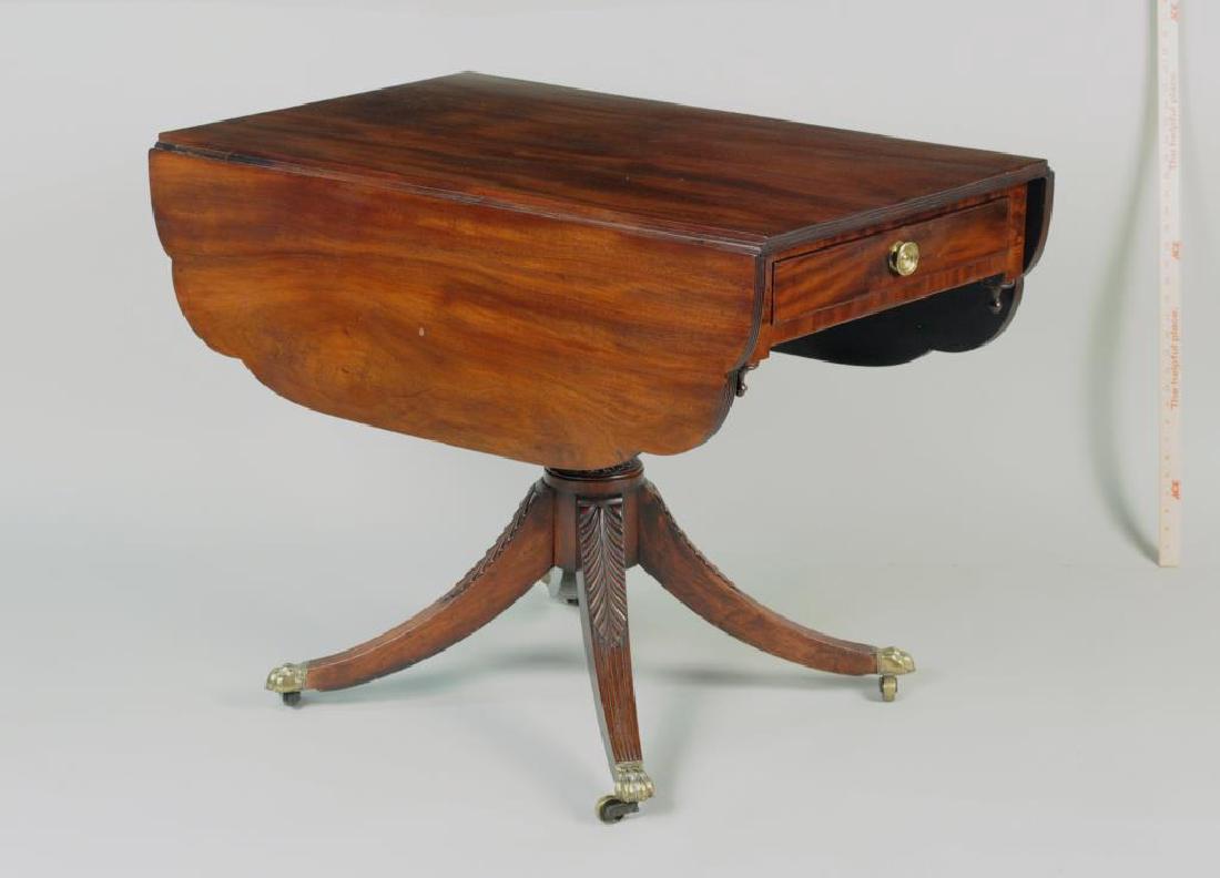 New York Federal Dropleaf Breakfast Table: attributed to the shop of Duncan Phyfe, with cloverleaf drop leaf top with reeded edge, one working drawer, acanthus carved central column and four acanthus carved and reeded legs ending in brass paw