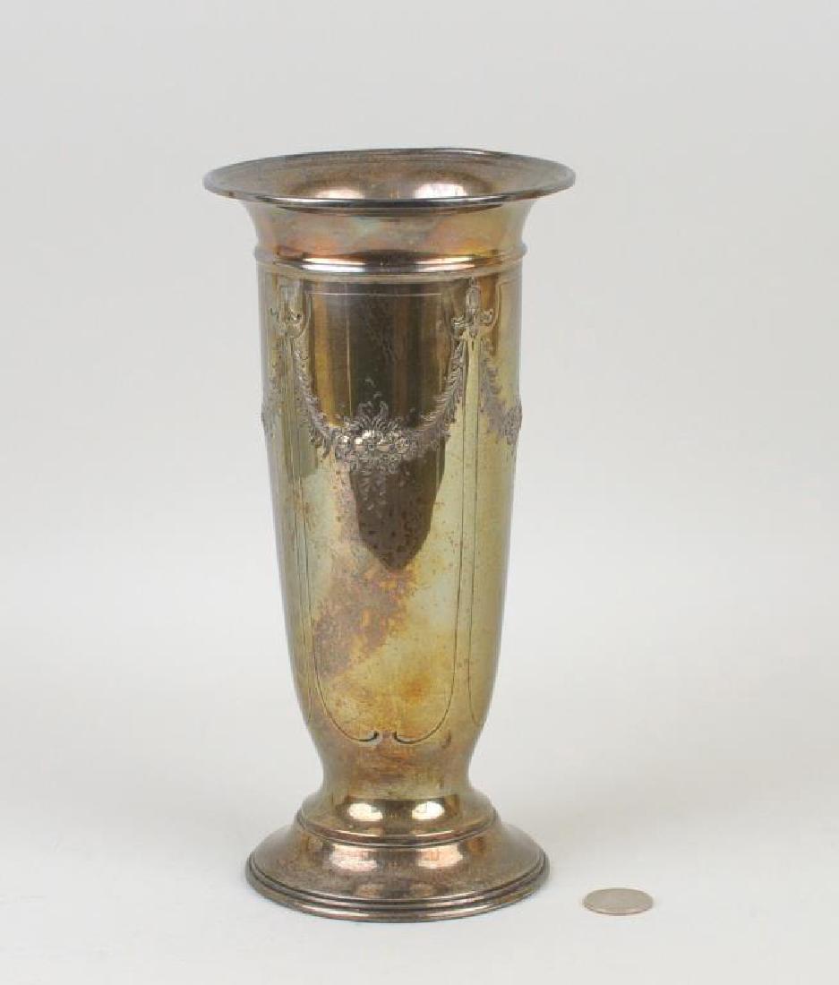 Acme Sterling Silver Vase: with floral repousse decoration. A few small dings, rim dents. 10" high, 5" diameter. Weight: 13.045 OZT.