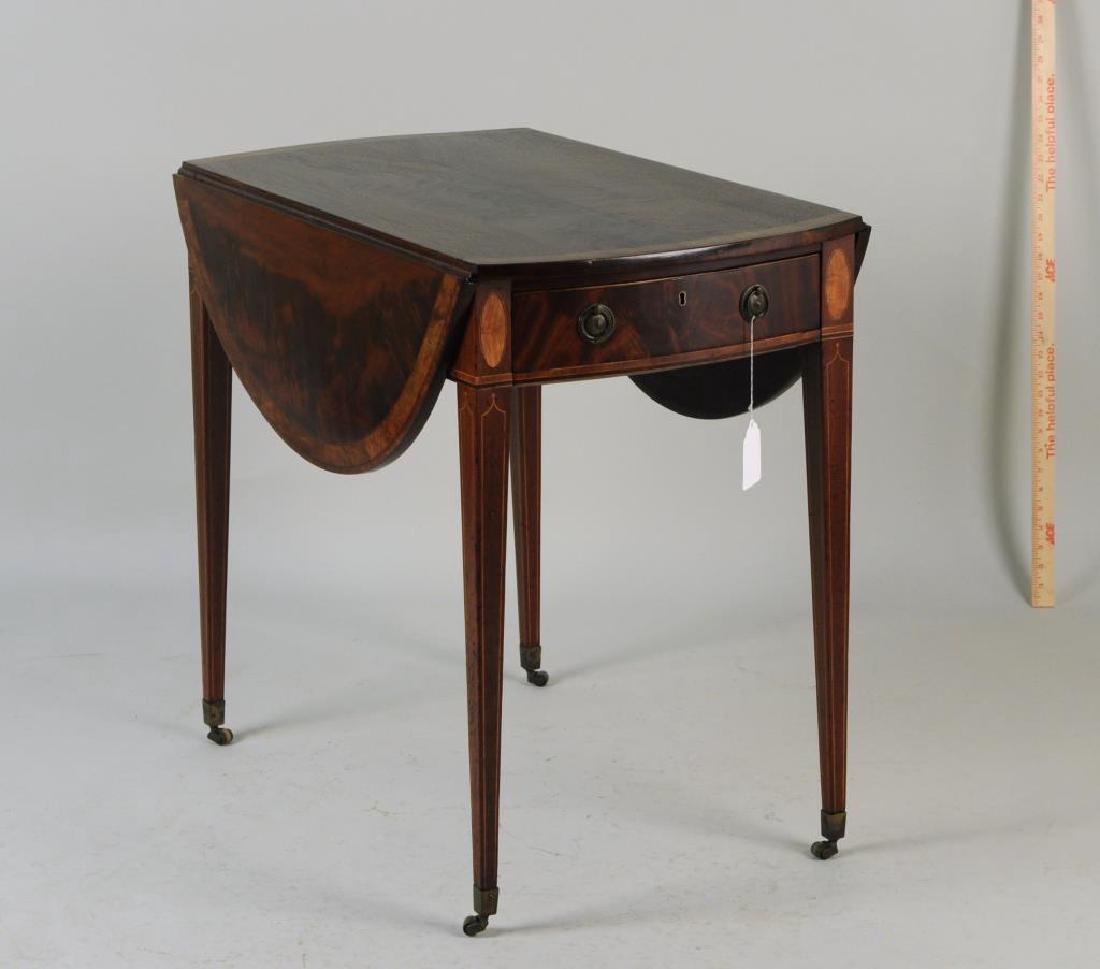 George III Inlaid Mahogany Oval Pembroke Table: with the oval top crossbanded with two falling leaves, the base with string inlay and frieze drawer on inlaid tapering legs headed by satinwood ovals. Hardware old but replaced, refinished, minor vene
