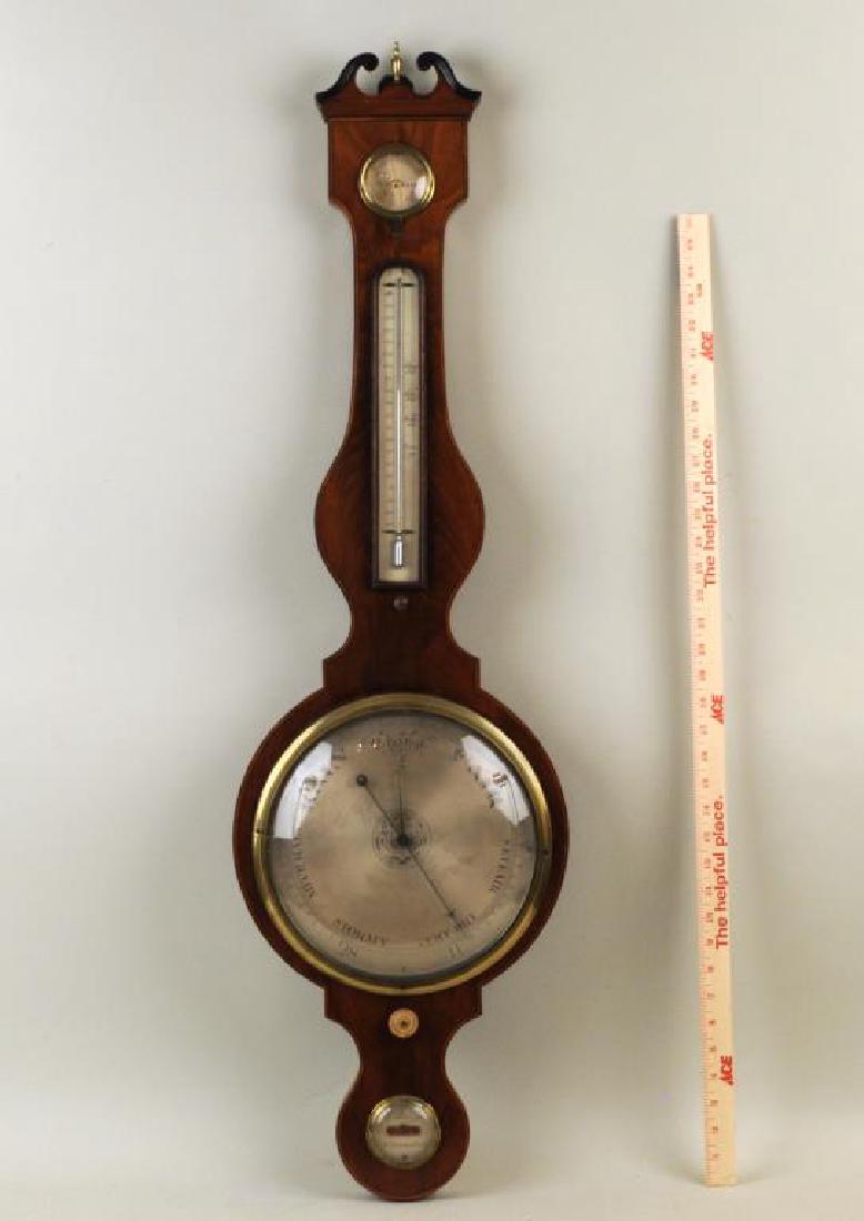 G. Brogg English Mahogany & Brass Banjo Barometer: with etched steel dials. Finish wear, loss, age cracks, repairs, small chips, losses. 42 1/2" high, 12" wide. Provenance: A Greenwich CT Estate.