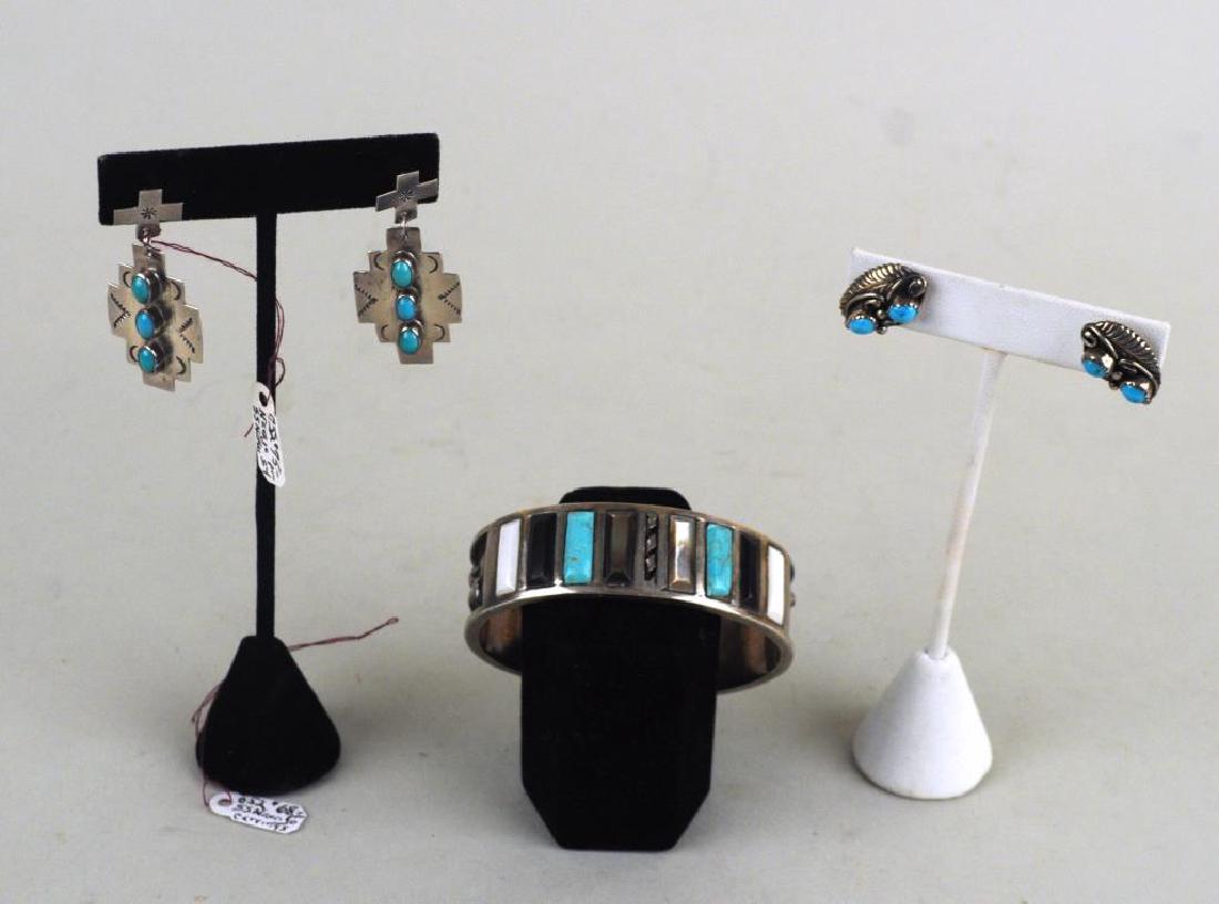 Native American Silver Cuff/Earrings: comprising a .800 multistone cuff stamped "TBM?", pair Nakai cross earrings and oval earrings stamped "LC". Use wear, bends to posts, edge nicks to bracelet. Largest: 3/4" high, 2 5/8" wide. Gross wei