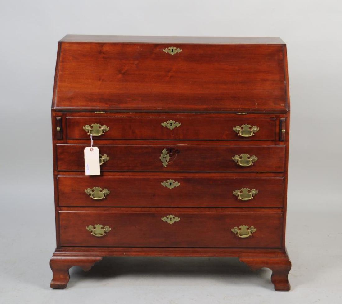 Chippendale Cherrywood Slant Front Desk: having fan carved interior, with ogee bracket base. Wear, scratches, brasses replaced, old repair to backboards. 42 1/2" high, 39" wide, 20" deep. Provenance: Estate of Eloise Hackworth, Buffalo, NY.