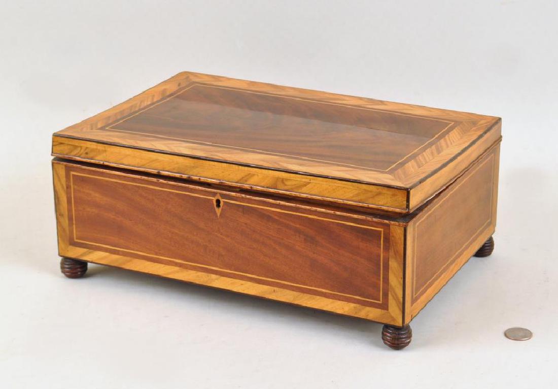 English Satinwood Inlaid Desk Box: with interior tray on bun feet. Age cracks, interior stains, top does not close completely, missing lock, small stains, edge nicks. 6" high, 14" wide, 9 1/2" deep. Provenance: Property of a Fairfield 