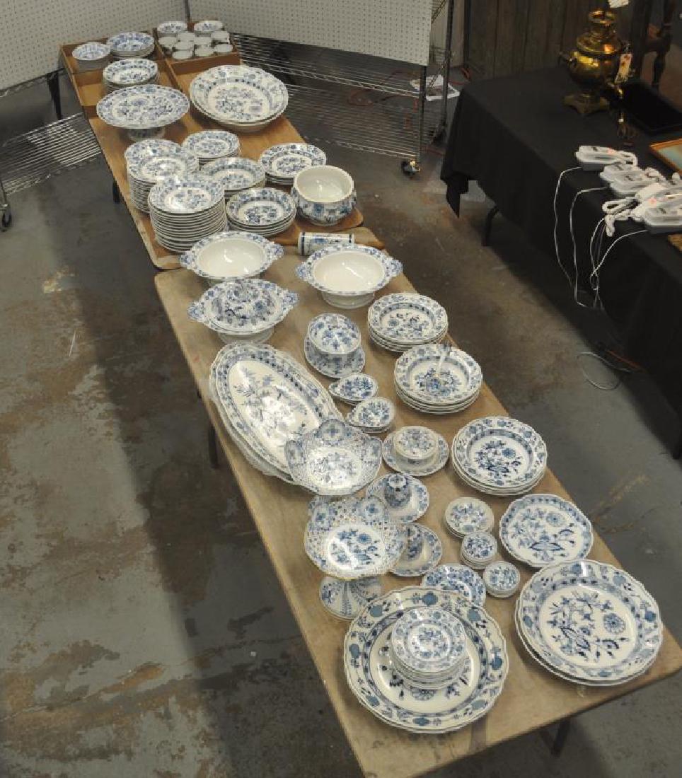 Meissen Porcelain B/W Partial Dinner Service: Meissen Porcelain B/W Partial Dinner Service in the Onion pattern comprising thirty-seven plates (five with gilt rims, one plate slightly larger), twenty-four soup bowls (one with gilt rim), twelve sa