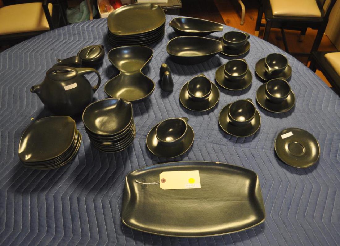 Roseville Raymour Pottery Partial Service: Roseville Raymour Pottery Partial Service comprising eight dinner plates, eight salad plates, eight bowls, seven coffee cups, eight saucers, coffee pot, covered sugar, covered creamer, two graduated s